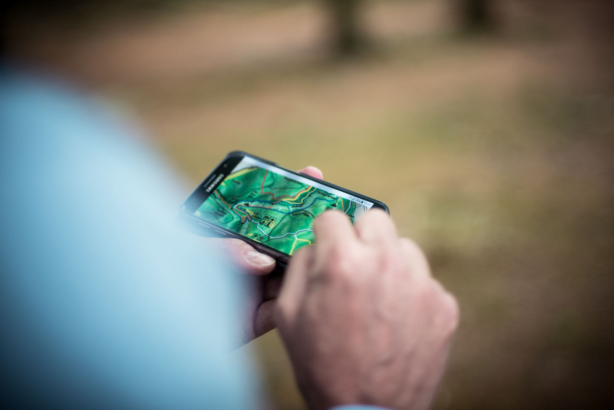 Person using a map on a smartphone